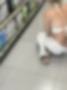 Blonde college girl squatting deep in supermarket, visible thong!