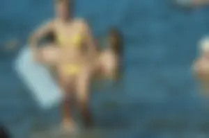 Milf in Yellow Swimsuit Beach Candid Gallery