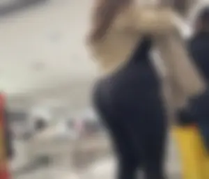 Fat butt Latina in black leggings shopping at h&m