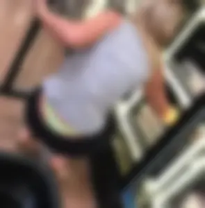 Blonde Sitting with Panties Sticking Out from under Pants