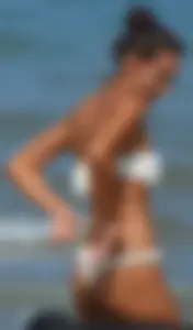 Hot girl at the beach with a nice ass in a white bikini