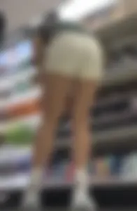 Amazing Asian in white yoga shorts upshot bends squat at Target