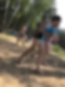 Wet Girls in Swimsuits Walking Towards Water at a Lake Beach Photo Series