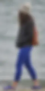 Cute girl with a nice ass in tight blue leggings along the water in San Fran