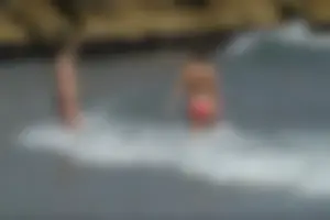 Girls on a nude beach in Sitges, Spain