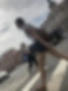 Young Girl in Shorts And Sandals Crossing the Street Gallery
