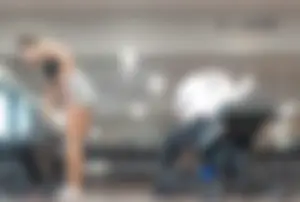 Gym brunette in tight grey shorts bending over, part 3