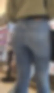 Girl wearing tight blue jeans at the store, closeups of her hot ass