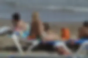 Girls on a nude beach in Sitges, Spain