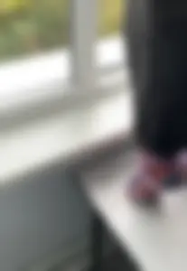 Teen Arts Student in Socks Standing on Tiptoes on Top of the Desk Feet Closeup