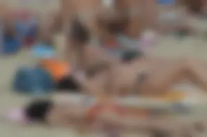 Topless girls on a beach in Barcelona