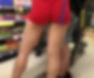 Amazing candid closeups of a hot girl's ass in red spandex mini shorts at the supermarket