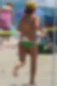 Bunch of sexy babes at the beach in bikinis