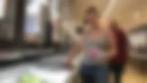 Thick girl showing cleavage while downbloused at the market