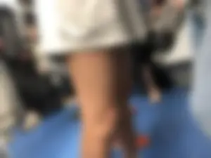 Hot slim legs in shorts public transport closeup