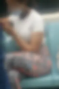 Girl in Colorful Tights Sitting in a Subway Train Crossing Her Hot Legs