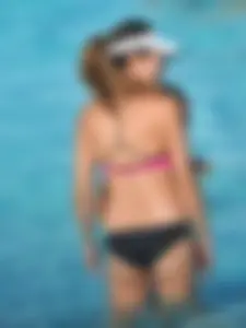 Asian milf in black and pink bikini at the beach
