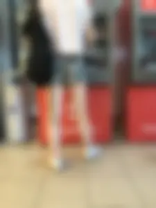 Candid Girl With Nice Skinny Legs in Shorts at the ATM Photos
