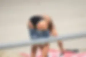 Blonde and brunette on the beach looking sexy in their bikinis