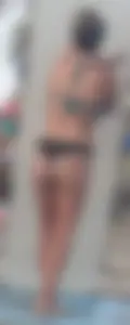 Beach shower milf in semi thong bikini with a nice ass