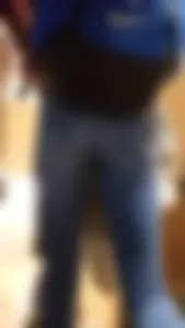 Blonde student in jeans showing her blue thong whale tail