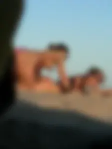 Bunch of sexy babes on the beach topless and in thong bikinis