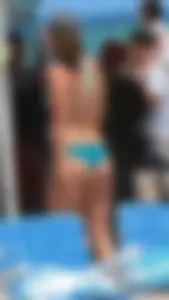 Bunch of sexy babes at the beach in bikinis