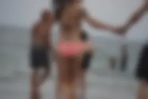 Peach bikini tattood babe on the beach with a nice ass and some camel toe