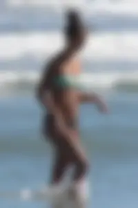 Beach girl out in a bikini with a nice round big booty