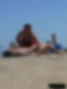 Purple thong topless lady on the beach gets oiled up by her husband