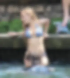 Sexy girl at the pool in a bikini with great tits