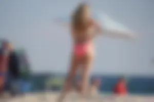 Thick blonde bikini babe on the beach