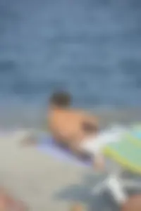 Sexy skinny babe in thong bikini on the beach