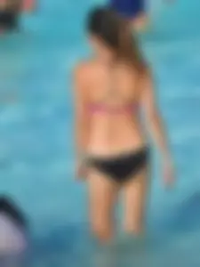 Asian milf in black and pink bikini at the beach
