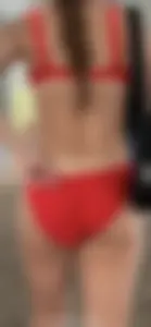 Beauty picks at her bikini wedgie