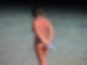 Blonde milf on the beach in her bikini