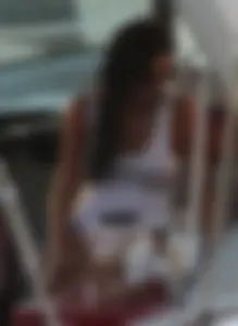 Bikini babe on a boat with a wet see through white shirt showing her tits