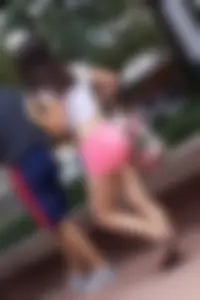 Sexy girl in pink shorts showing some cheek