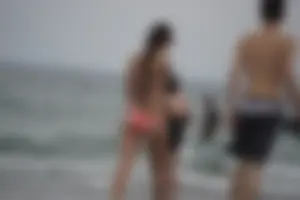 Peach bikini tattood babe on the beach with a nice ass and some camel toe
