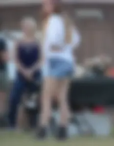 Hippie type dressed girl in denim shorts with a nice ass