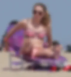 Cute babe in pink and black bikini with a bit of camel toe