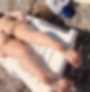 Large collection of hot beach girls lying on the beach and bending over