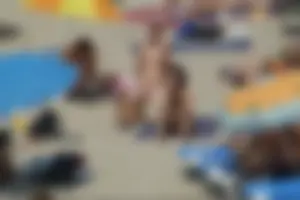 Girls on a nude beach in Sitges, Spain