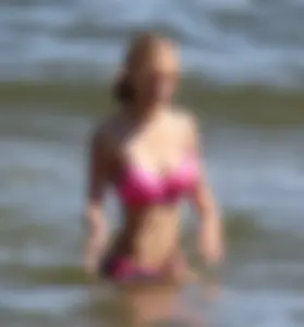 Two sexy beach teens in bikinis, one thick and one skinny with big boobs
