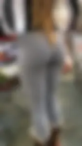 Amazing teen wearing grey leggings at the supermarket