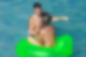 FKK Nudists playing in the water with floater