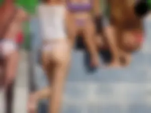 Hot chick with a nice ass at the pool in a white see through thong
