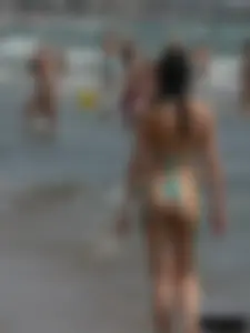 Bunch of sexy babes at the beach in thong bikinis