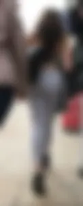 Sexy girl in see through grey leggings showing her thong