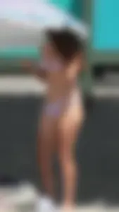 Bunch of sexy babes at the beach in bikinis
